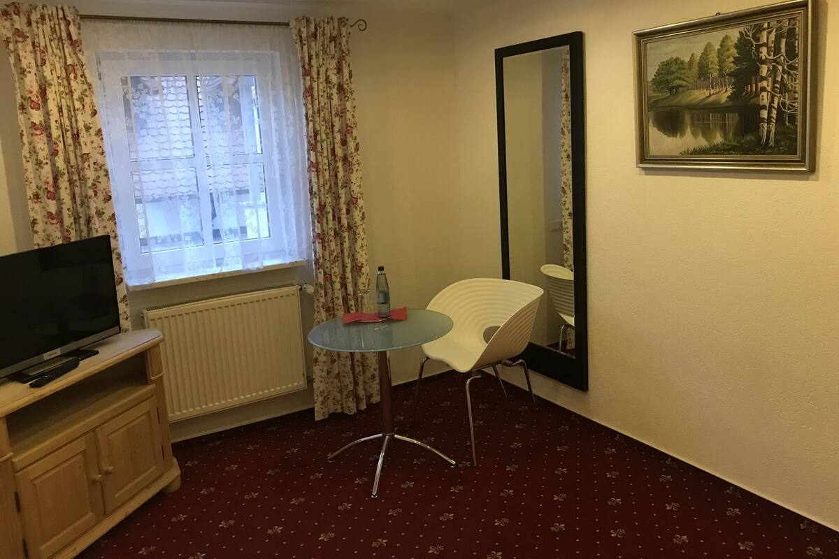 Economy Double Room, 2 Single Beds | Living area | Flat-screen TV, offices