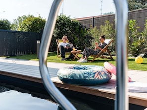 Seasonal outdoor pool, open 10:00 AM to 9:00 PM, free pool cabanas