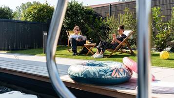 Seasonal outdoor pool, open 10:00 AM to 9:00 PM, free cabanas