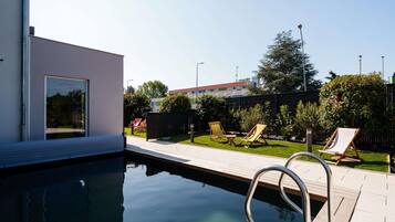 Seasonal outdoor pool, open 10:00 AM to 9:00 PM, free cabanas