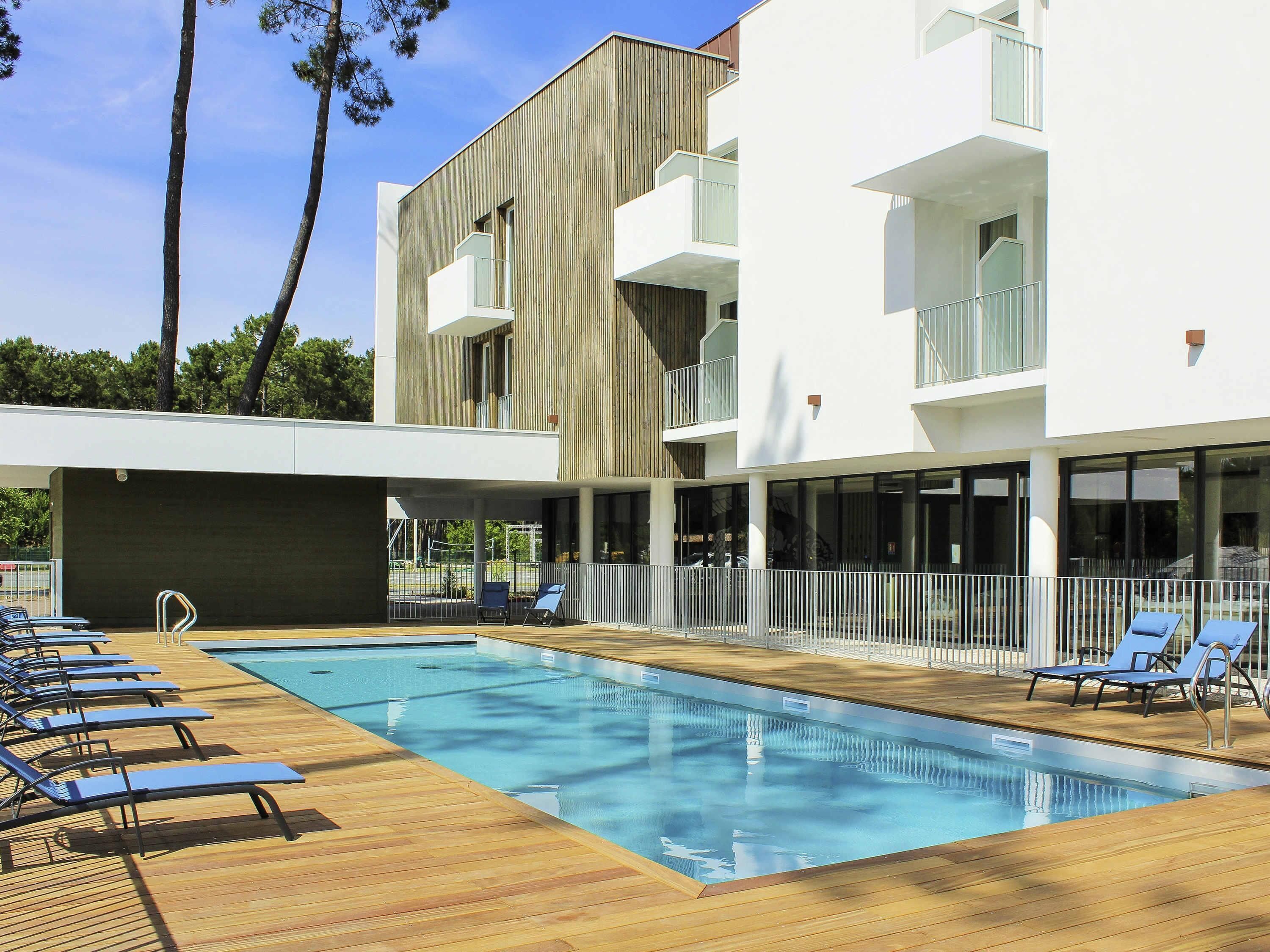 Seasonal outdoor pool, pool umbrellas, pool loungers