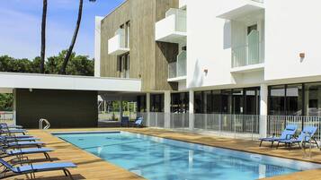Seasonal outdoor pool, pool umbrellas, pool loungers
