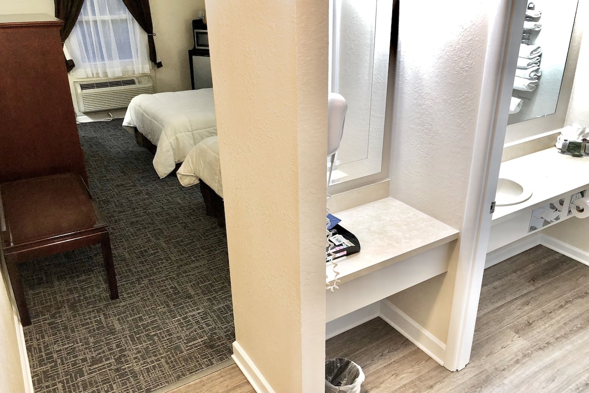 double room, 2 double beds | desk, laptop workspace, blackout curtains, iron/ironing board