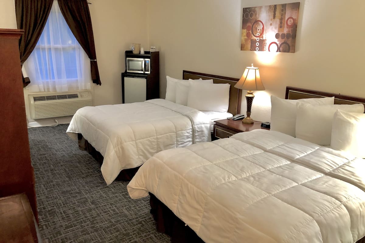 double room, 2 double beds | desk, laptop workspace, blackout curtains, iron/ironing board