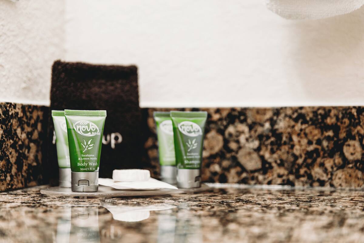 eco-friendly toiletries, hair dryer, towels, soap