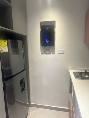 A kitchen with a built-in microwave and a stove.
