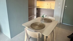 A compact kitchen with a built-in stove, a sink, and a small countertop.