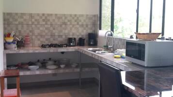 Microwave, coffee/tea maker, toaster, cookware/dishes/utensils