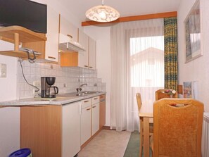 Fridge, cookware/dishes/utensils, dining tables