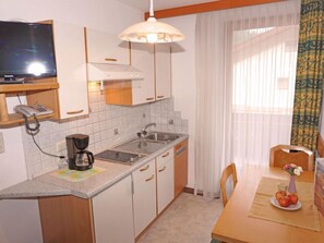 Fridge, cookware/dishes/utensils, dining tables