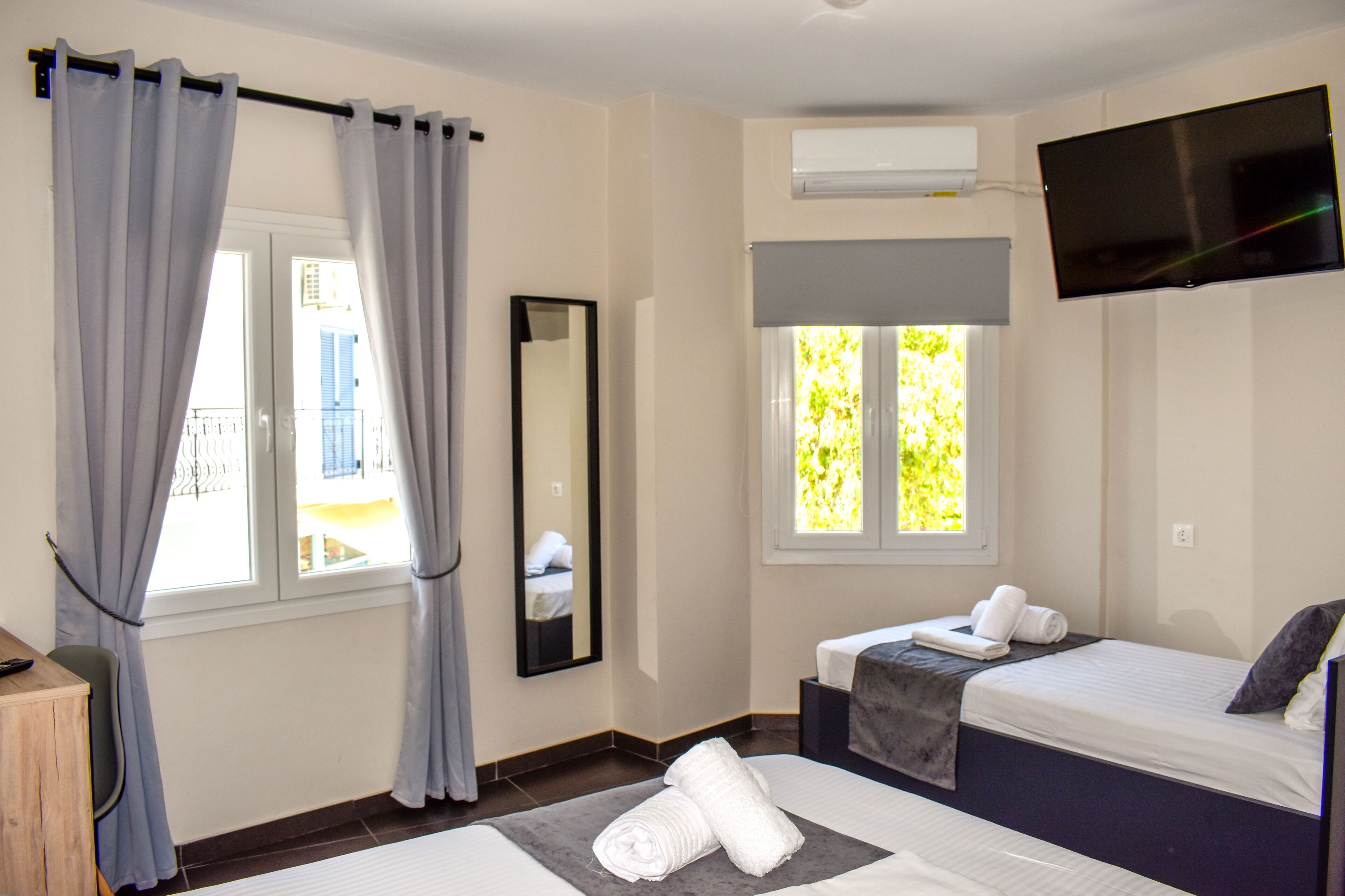 deluxe triple room, city view | 1 bedroom, premium bedding, pillow-top beds, in-room safe
