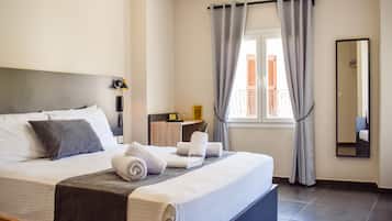 Chambre Triple Deluxe, vue ville | Literie de qualité supérieure, surmatelas