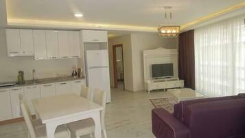 Luxury Apartment, Kitchen | In-room dining