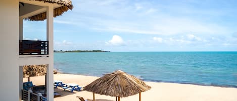 On the beach, white sand, free beach cabanas, sun-loungers