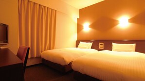 A hotel room with two beds, a desk, a chair, and a TV. - Ab Hotel Okazaki (Okazaki)