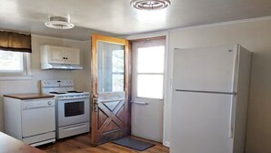 A compact kitchen with a stove, oven, and refrigerator. - Quiet, Comfortable Location! w/Double Garage
Easy access to WyoTech and UW (Laramie)