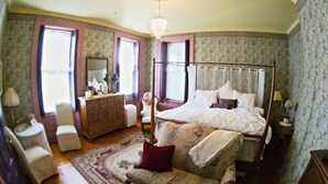 A bedroom with a four-poster bed, a dresser, a chair, and a nightstand. - Susquehanna Manor Inn (Marietta)