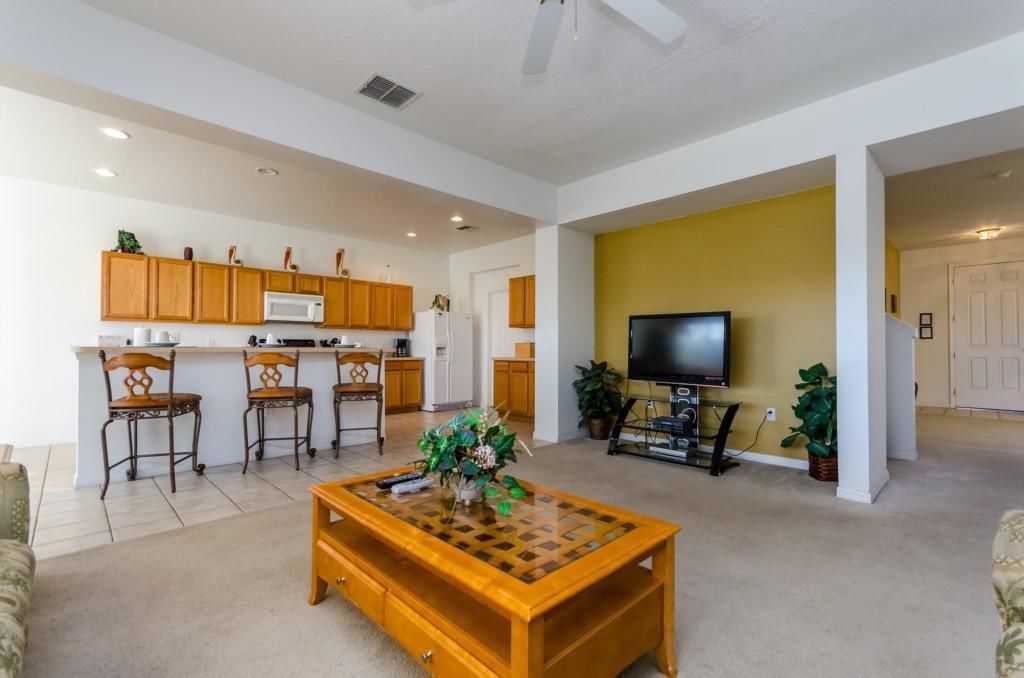 House, Multiple Beds (113BLL Disney 5 Bedroom Pool Home Wit) | Living area | TV, books