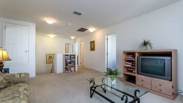 House, Multiple Beds (113BLL Disney 5 Bedroom Pool Home Wit) | Living area | TV, books