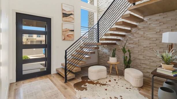 A modern interior with a staircase, a door, and a view of the outside. - Golf Course Views, Private Pool, Hot Tub, Fire Pit (Washington)