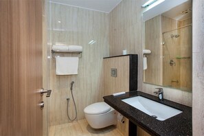 Deluxe Room | Bathroom | Shower, rainfall showerhead, free toiletries, towels - Pebbles (Chennai)