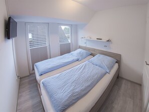 2 dormitorios, tabla de planchar con plancha, cuna de viaje y wifi