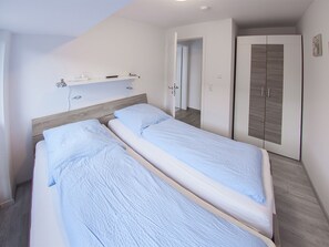 2 dormitorios, tabla de planchar con plancha, cuna de viaje y wifi