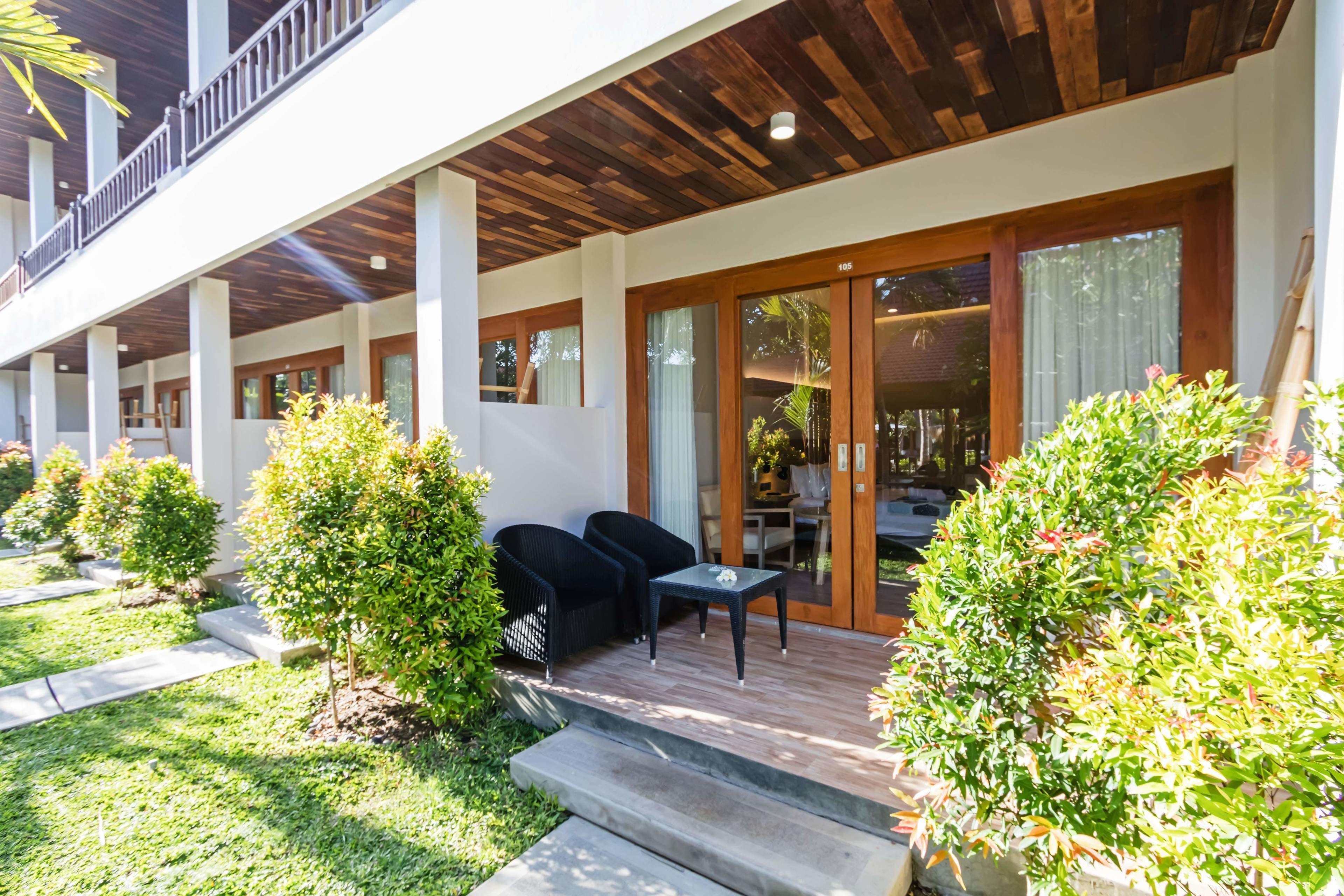 deluxe double room, garden view | terrace/patio