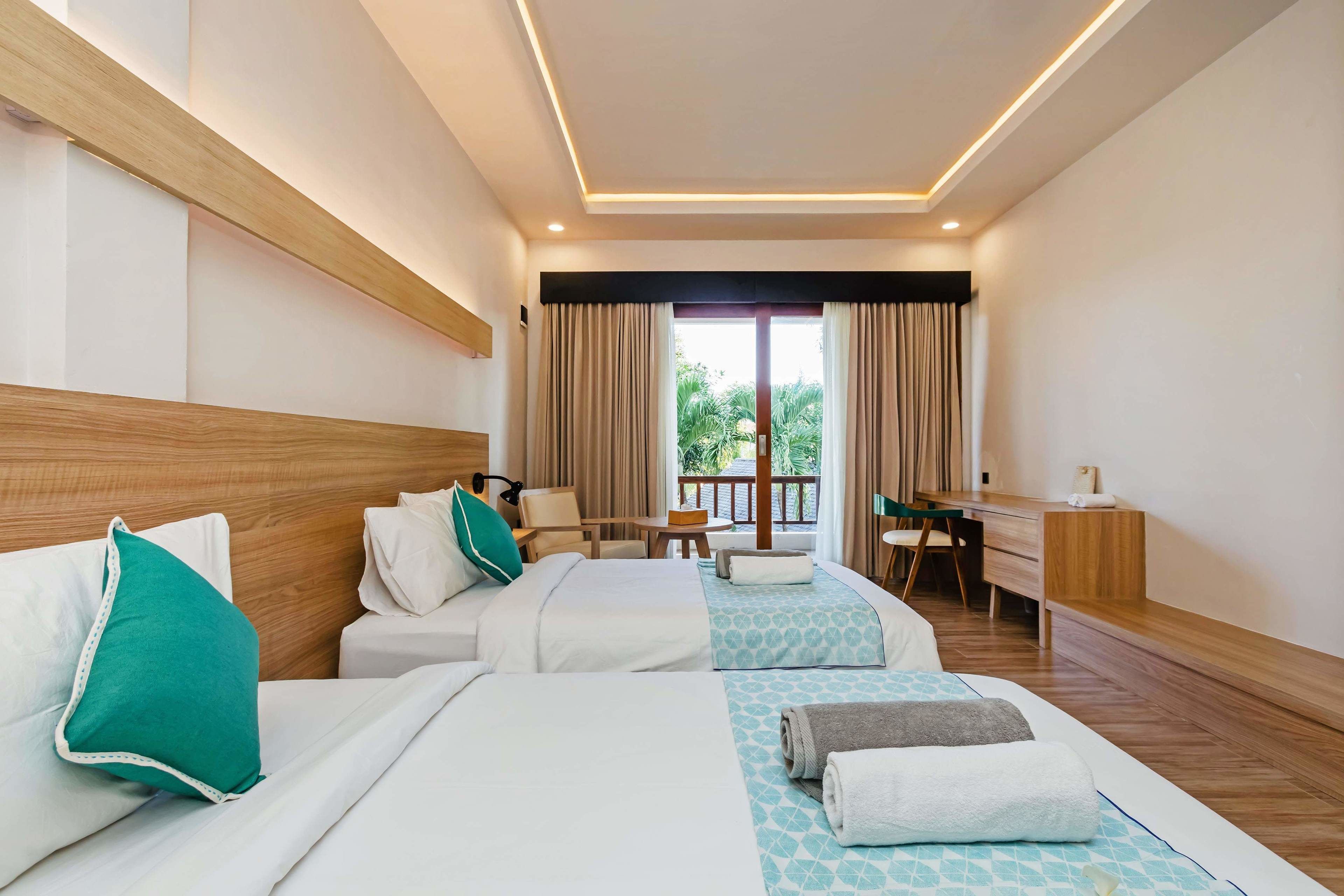 deluxe twin room, garden view | 1 bedroom, free minibar, in-room safe, individually decorated