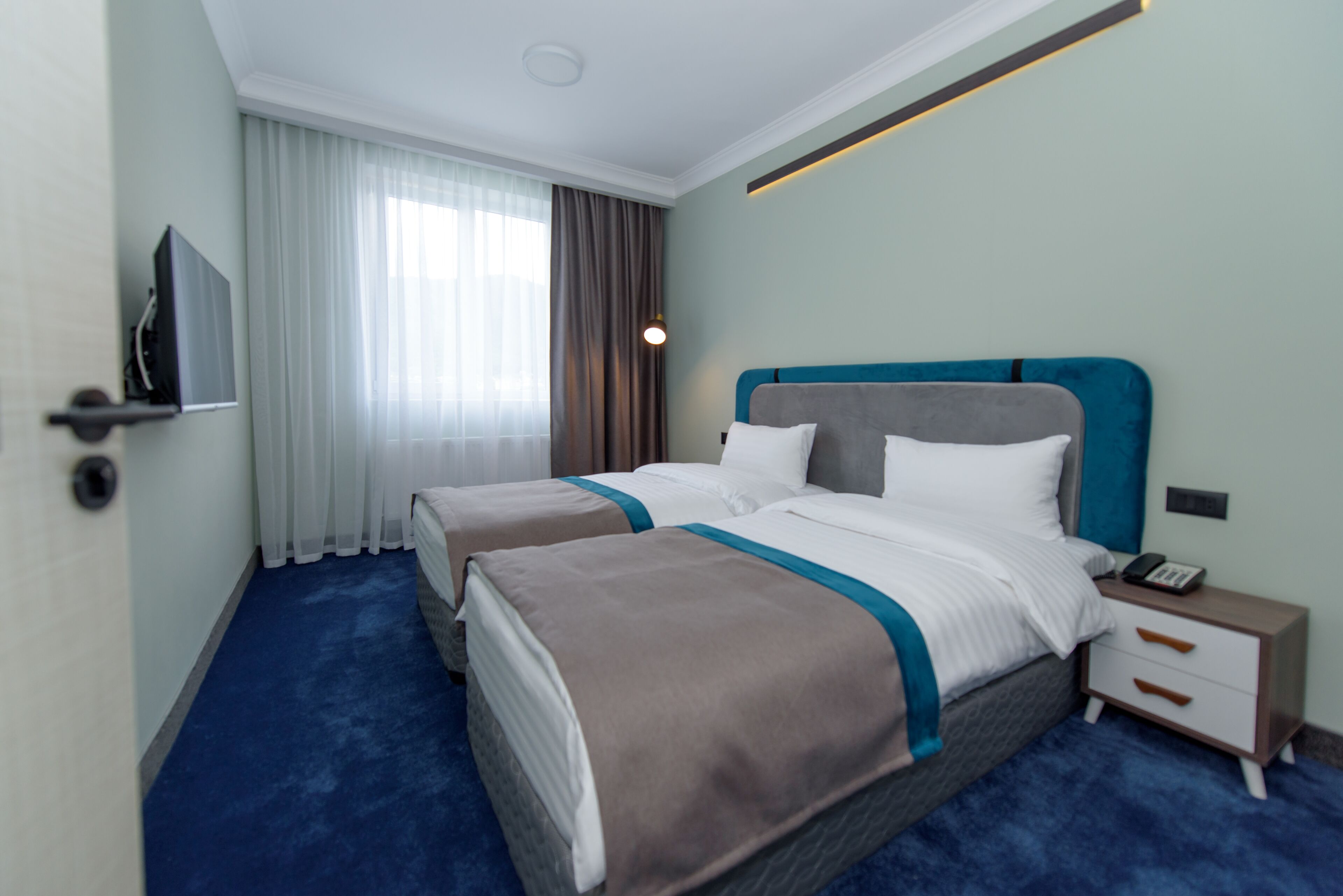 Executive Quadruple Room | Private kitchen | Mini-fridge, electric kettle, cookware/dishes/utensils