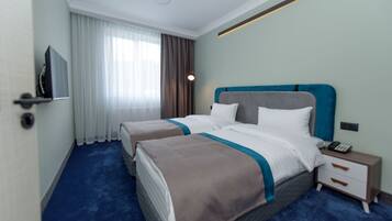 Executive Quadruple Room | Private kitchen | Mini-fridge, electric kettle, cookware/dishes/utensils