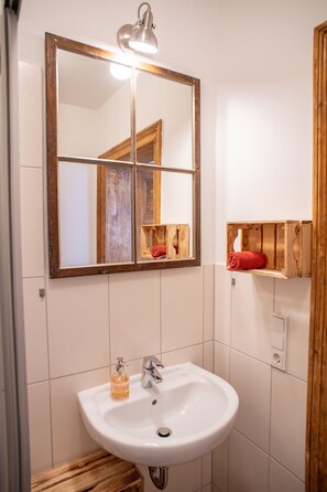 Shower, towels, soap, toilet paper