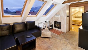 Apartamento família, 1 quarto | Área de estar
