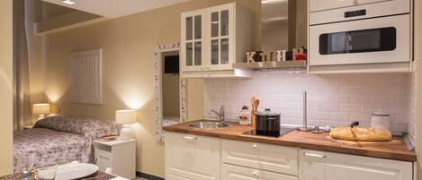 Fridge, microwave, stovetop, coffee/tea maker