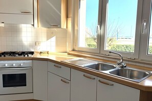 Fridge, oven, dining tables