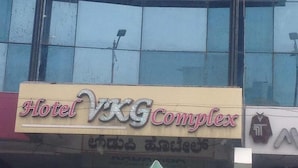 A building with a sign that reads "VKG LODGE" and "Hotel VKG Complex". - Iroomz VKG Complex (Bijapur)