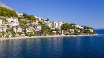 On the beach, sun-loungers