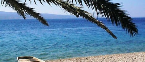 On the beach, sun-loungers