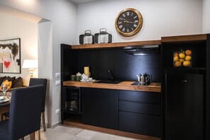 Fridge, microwave, stovetop, coffee/tea maker