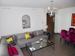 Deluxe Apartment, Multiple Beds, Partial Ocean View | Living area