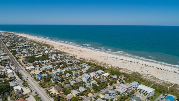An aerial view of a coastal residential area with houses, a beach, and the ocean. - Beachy Getaway–Cozy, Clean & Equipped w/ All Essentials! Relax, Enjoy & Refresh! (St. Augustine)