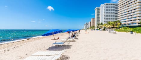 On the beach, sun-loungers, beach towels