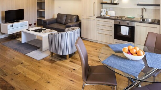 A modern apartment with a living room, dining area, and kitchen. - Baggot Rath by Interhome (Dublin)