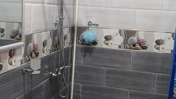 Bathtub, bidet, towels, soap