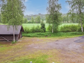 A rustic cabin with a dirt ground in front, surrounded by trees and a grassy field. - Joutsen by Interhome (Ruovesi)