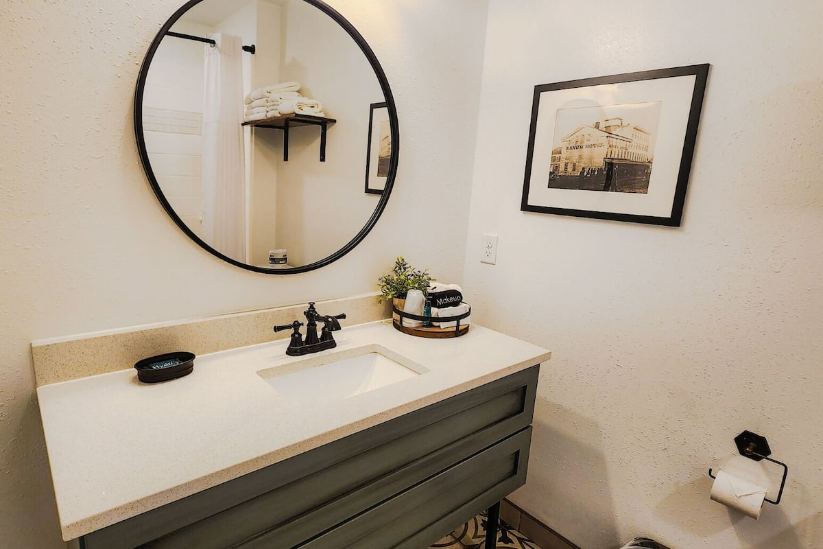 designer toiletries, hair dryer, towels, soap