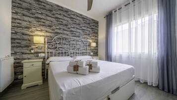 2 dormitorios, tabla de planchar con plancha, ropa de cama