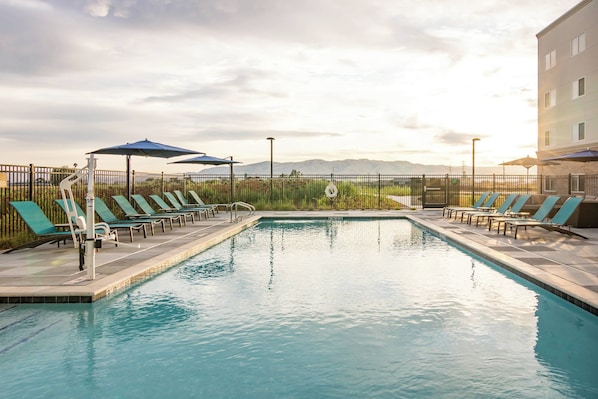 Outdoor pool, open 6:00 AM to 9:00 PM, pool umbrellas, pool loungers