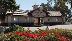 A building with a sign reading "GROVER BEACH" and the number "80" on the front. - Ocean-View 2 Bedroom Home Sleeps 6 Steps From Beach & Train Station, Pets OK (Grover Beach)