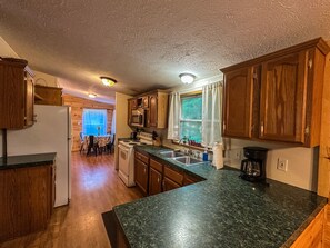 Coffee/tea maker, fridge, microwave, oven